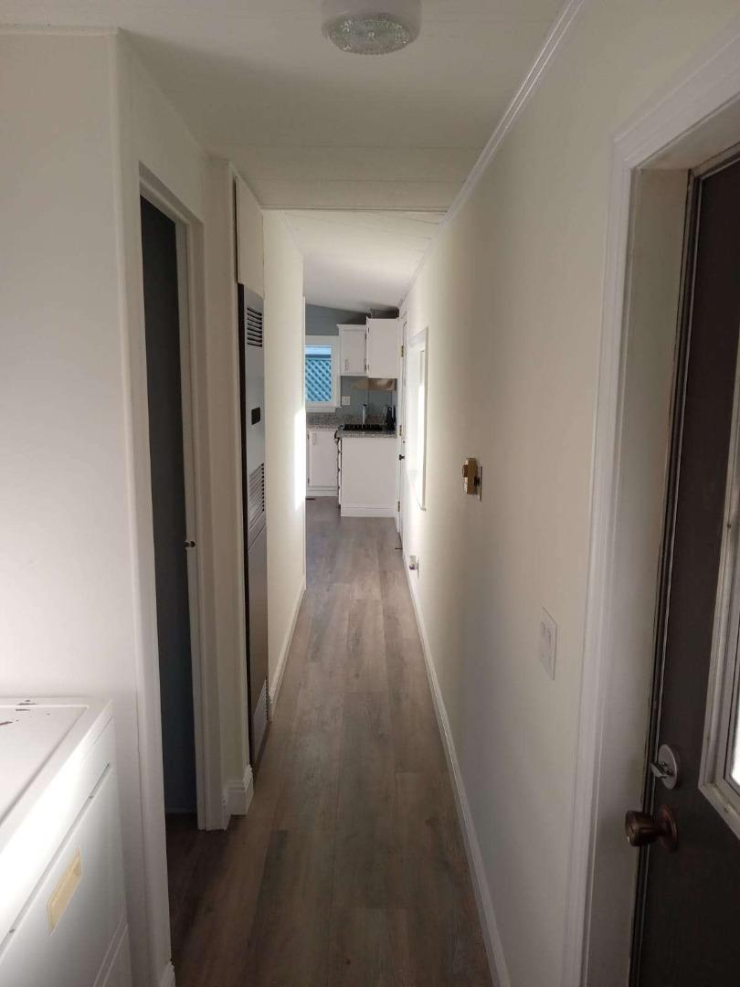 44 The Trees Drive, Unit 44 Concord, CA 94518 - Photo 16 of 22 a view of a hallway with wooden floor