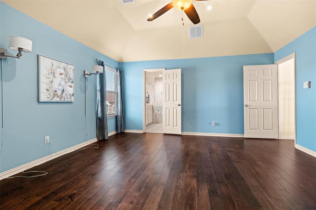 2803 Pino Grand Prairie, TX 75054 - Photo 22 of 36 an empty room with wooden floor and windows