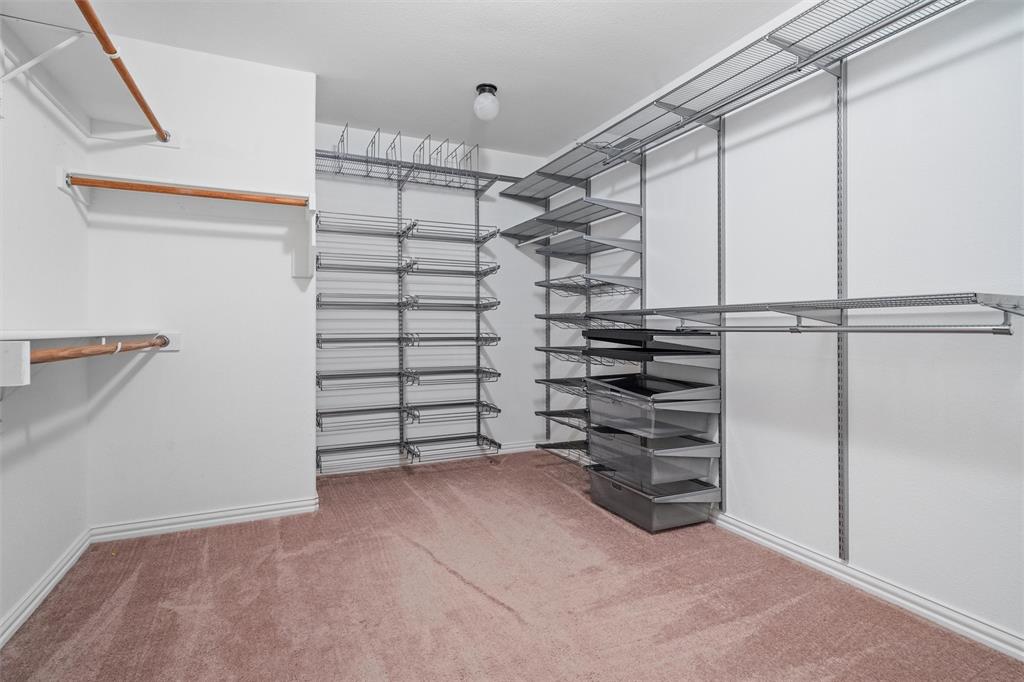 2803 Pino Grand Prairie, TX 75054 - Photo 23 of 36 a view of walk in closet with empty racks