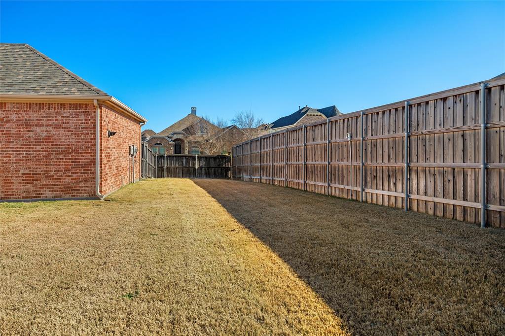2803 Pino Grand Prairie, TX 75054 - Photo 28 of 36 a view of a backyard with wooden fence