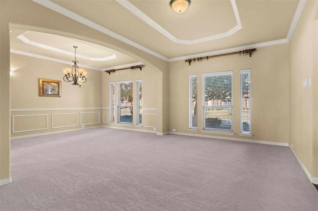 2803 Pino Grand Prairie, TX 75054 - Photo 3 of 36 en empty room with windows and ceiling fan