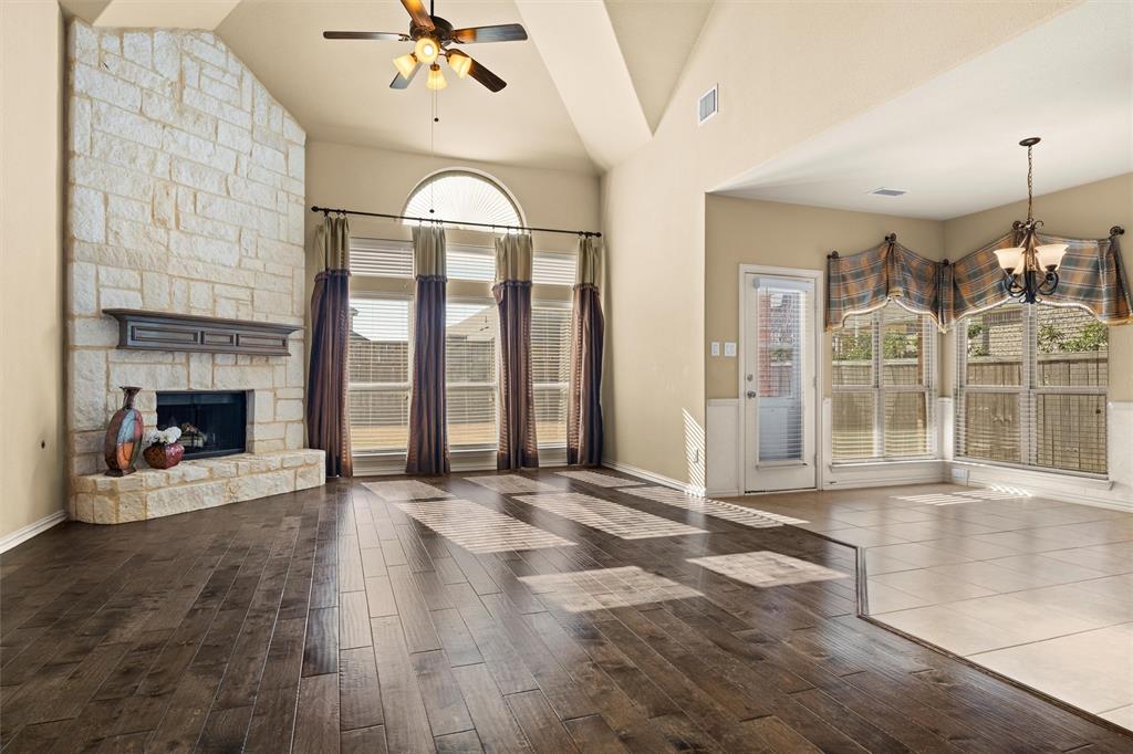 2803 Pino Grand Prairie, TX 75054 - Photo 4 of 36 a view of an empty room with wooden floor and a fireplace
