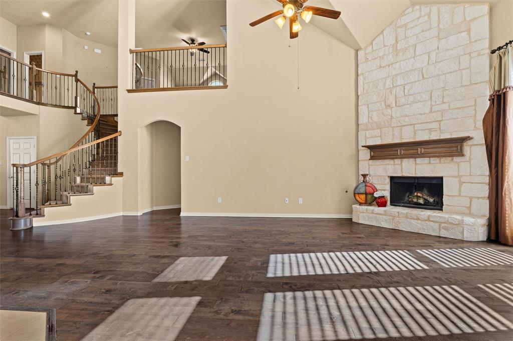 2803 Pino Grand Prairie, TX 75054 - Photo 5 of 36 a view of a livingroom with wooden floor and a fireplace