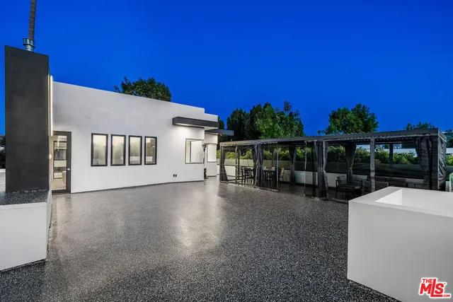 a view of a white house and a street view