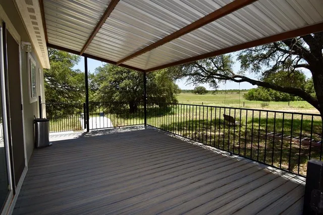 a view of a patio with wooden floor
