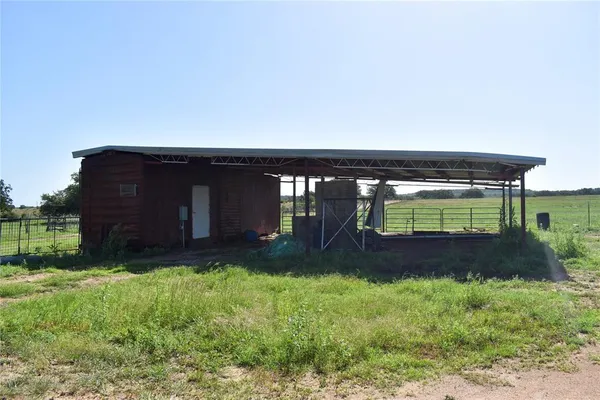 a backyard of a house with lots of green space and garden