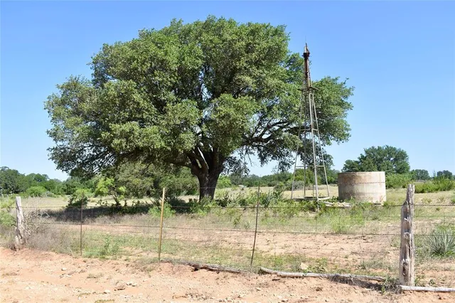 a view of a lake with a house in the background
