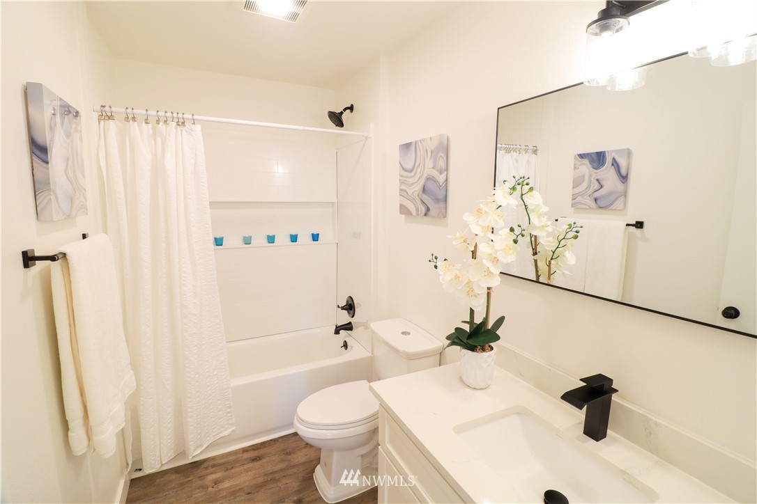 9331 Cullens Road Southeast Yelm, WA 98597 - Photo 19 of 28 a bathroom with a sink toilet and shower