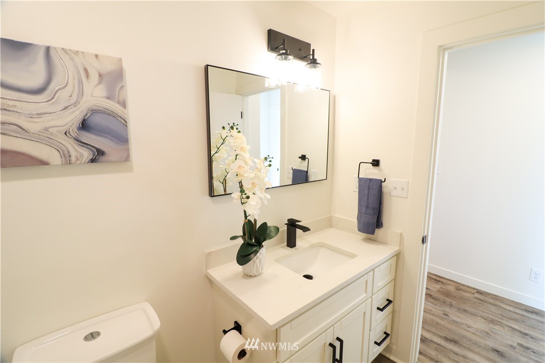 9331 Cullens Road Southeast Yelm, WA 98597 - Photo 20 of 28 a bathroom with a sink and a mirror