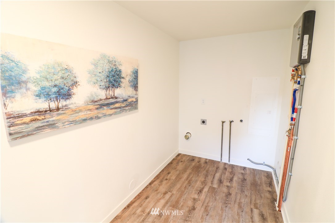 9331 Cullens Road Southeast Yelm, WA 98597 - Photo 21 of 28 a view of a room with wooden floor