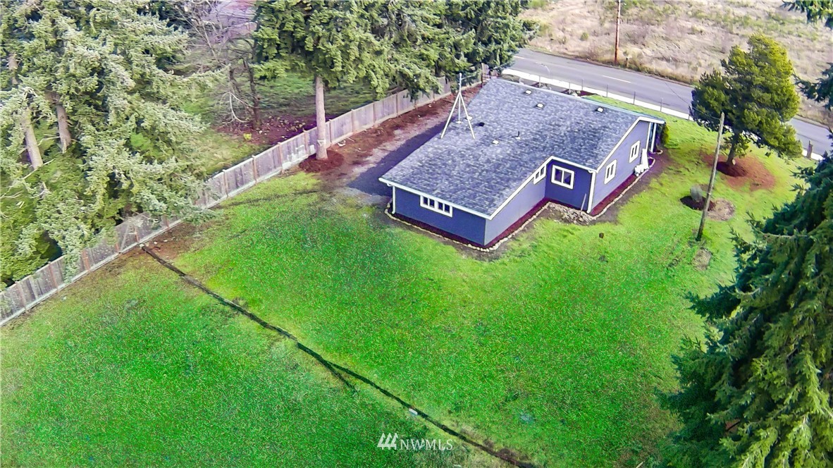 9331 Cullens Road Southeast Yelm, WA 98597 - Photo 25 of 28 a view of a back yard of the house