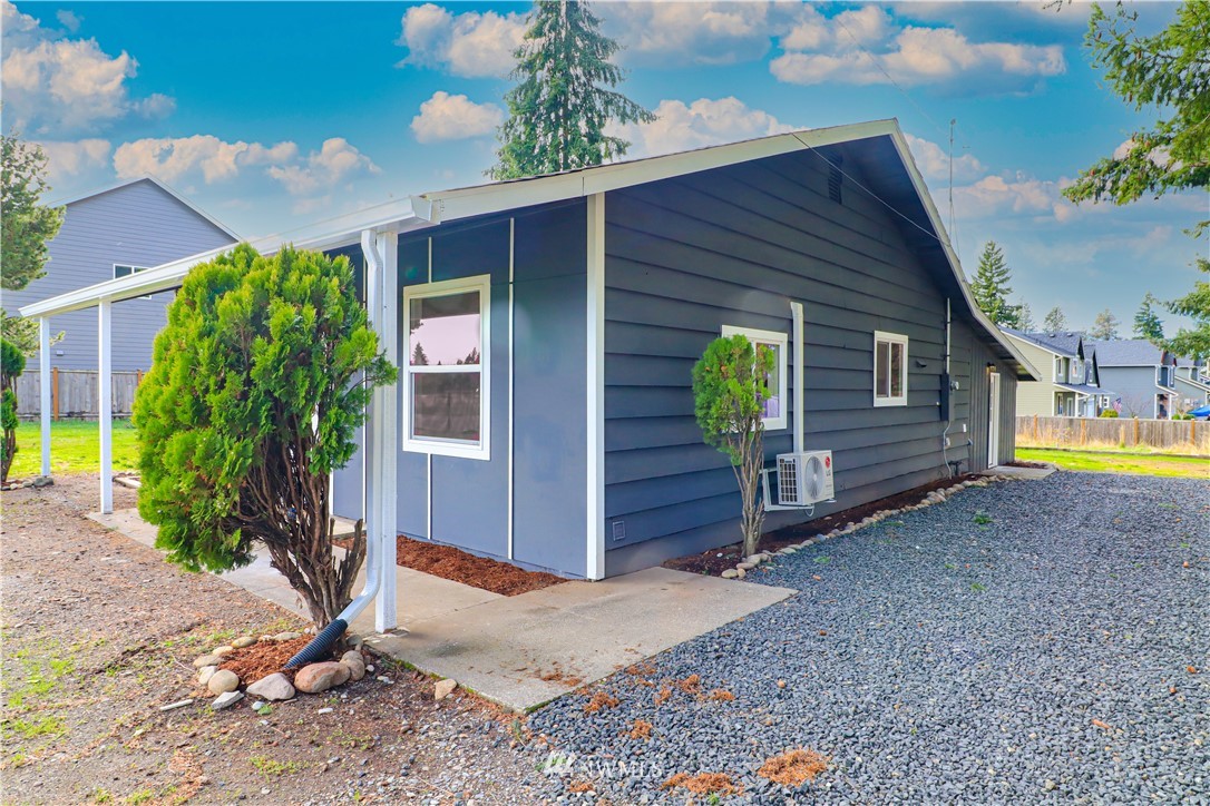 9331 Cullens Road Southeast Yelm, WA 98597 - Photo 3 of 28 a view of a house with backyard
