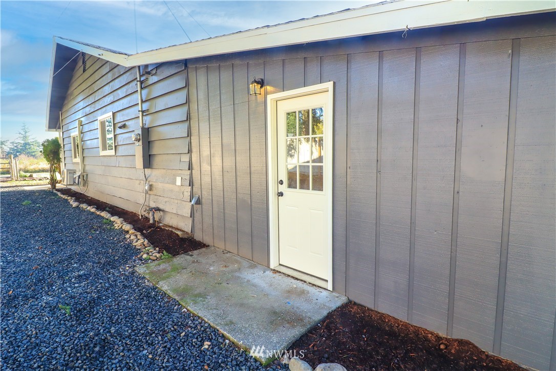 9331 Cullens Road Southeast Yelm, WA 98597 - Photo 4 of 28 a view of a house with a yard