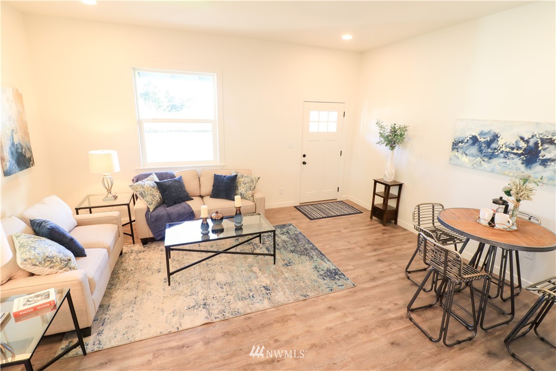 9331 Cullens Road Southeast Yelm, WA 98597 - Photo 6 of 28 a living room with furniture and a table