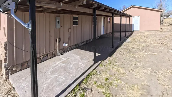 a balcony with view of wooden floor