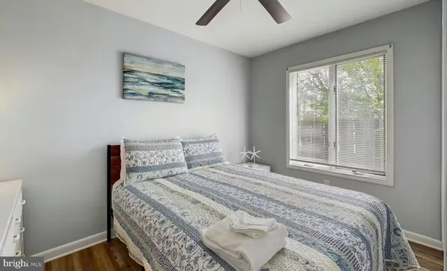 a bathroom with a sink a toilet and shower curtain