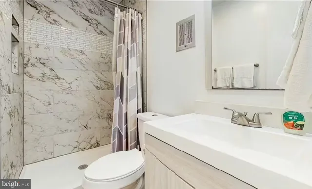 a view of a balcony with wooden floor and fence