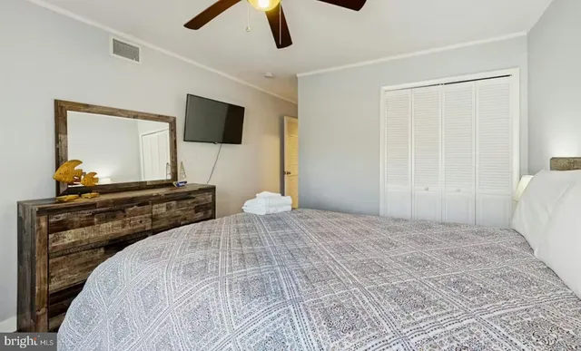 a bedroom with a bed and lamp