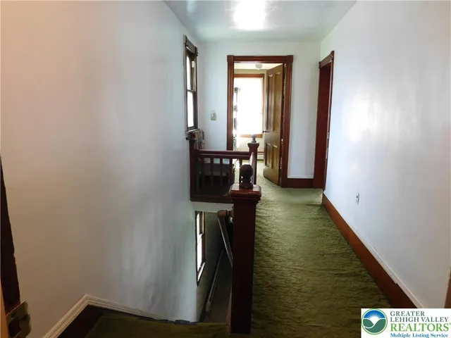 a view of a hallway with windows