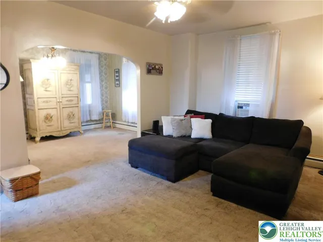 a living room with furniture and a window