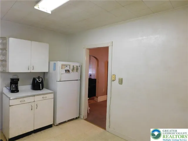 a utility room with cabinets washer and dryer
