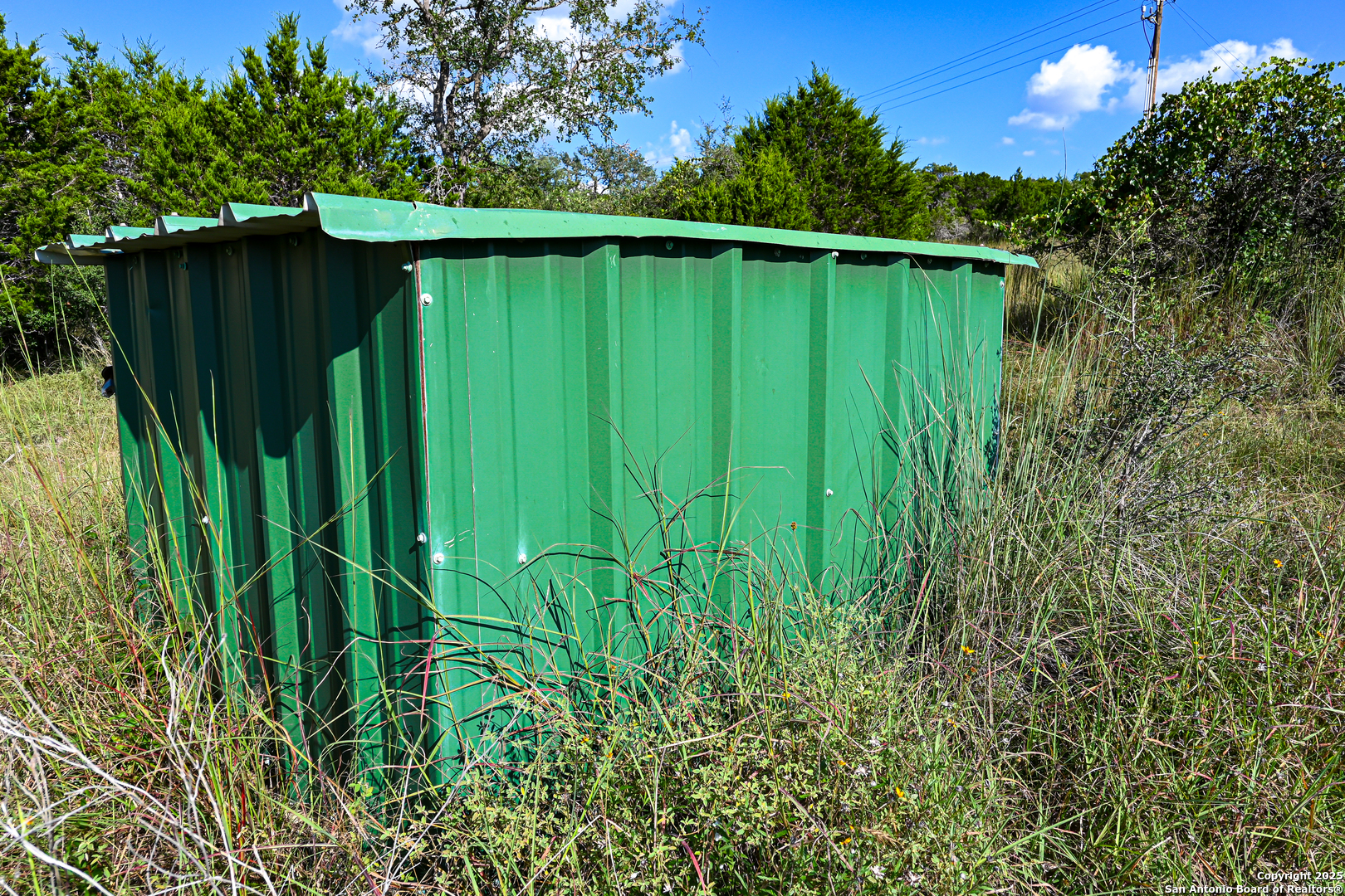 Tract 4 Jungfrau Hill Road Comfort, TX 78013 - Photo 17 of 25 a backyard of a house with plants and trees