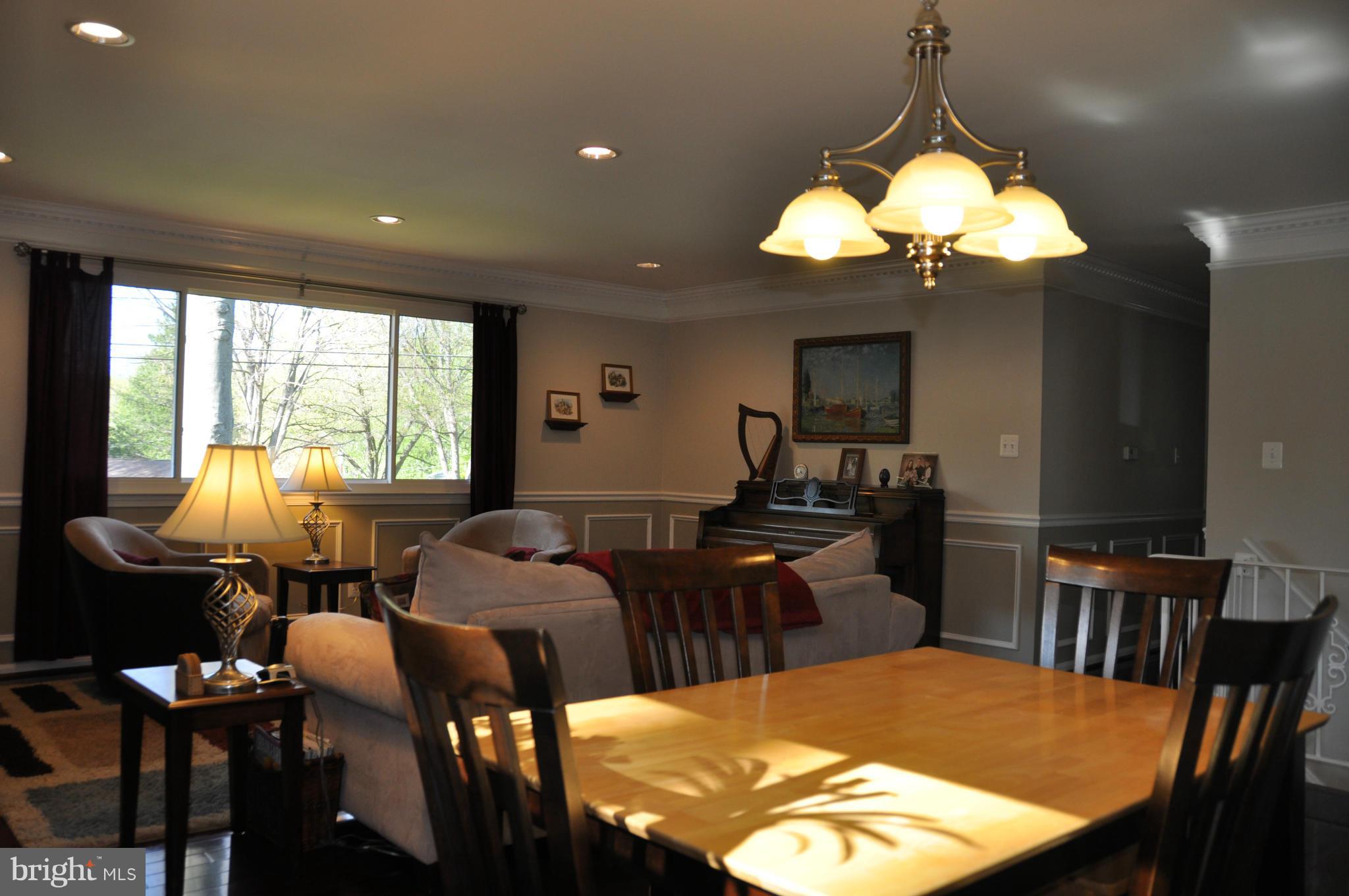 8621 Victoria Road Springfield, VA 22151 - Photo 2 of 27 a view of a dining room with furniture window and outside view
