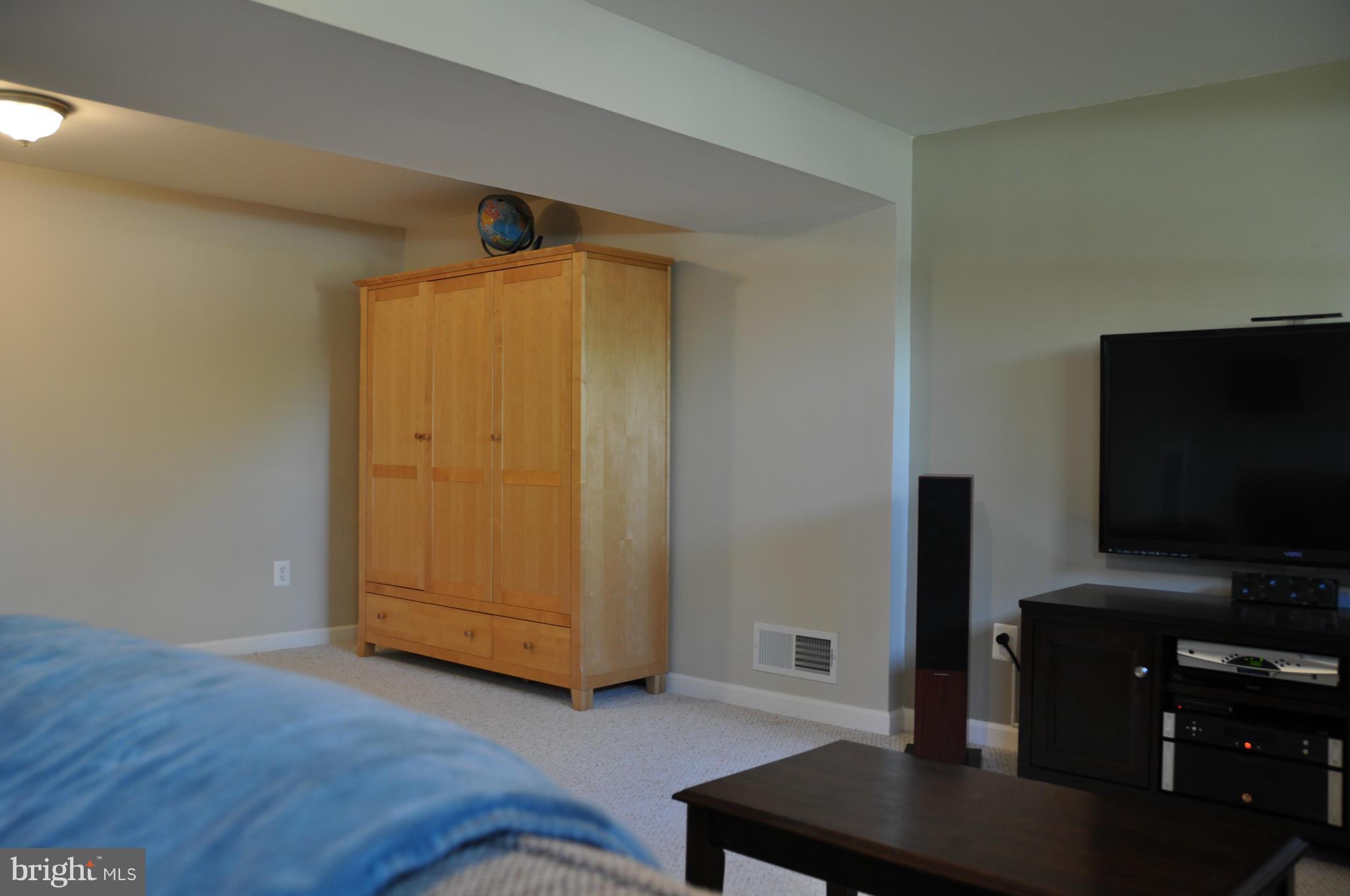 8621 Victoria Road Springfield, VA 22151 - Photo 11 of 27 a living room with furniture and a flat screen tv