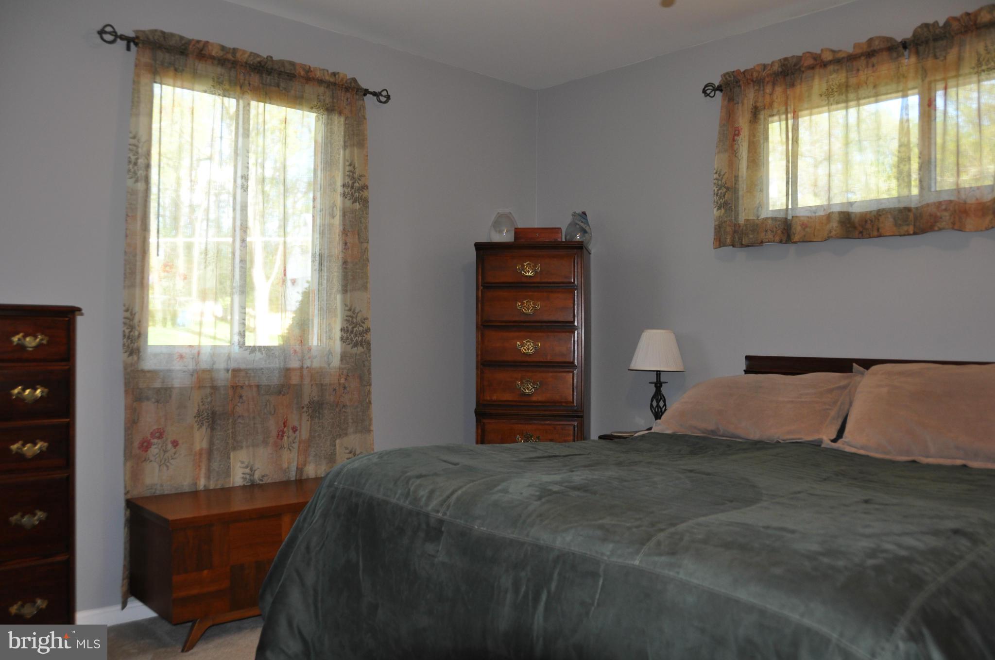 8621 Victoria Road Springfield, VA 22151 - Photo 16 of 27 a bedroom with a bed and a window