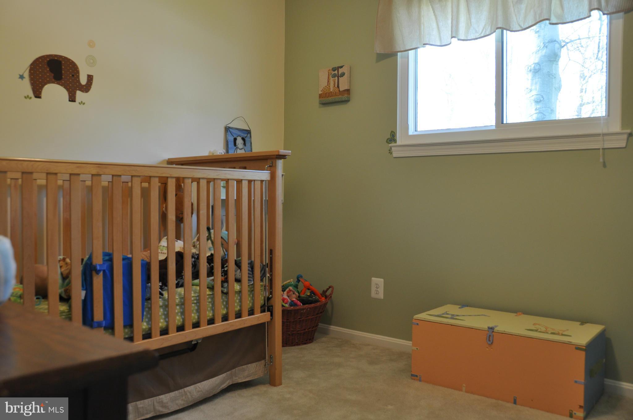 8621 Victoria Road Springfield, VA 22151 - Photo 20 of 27 a view of entryway with stairs and a window