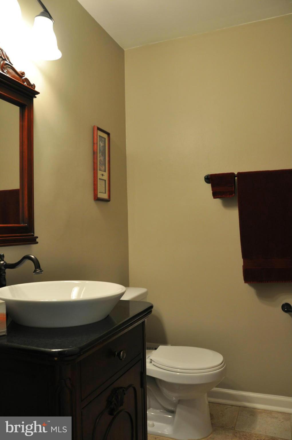 8621 Victoria Road Springfield, VA 22151 - Photo 21 of 27 a bathroom with a sink and a toilet