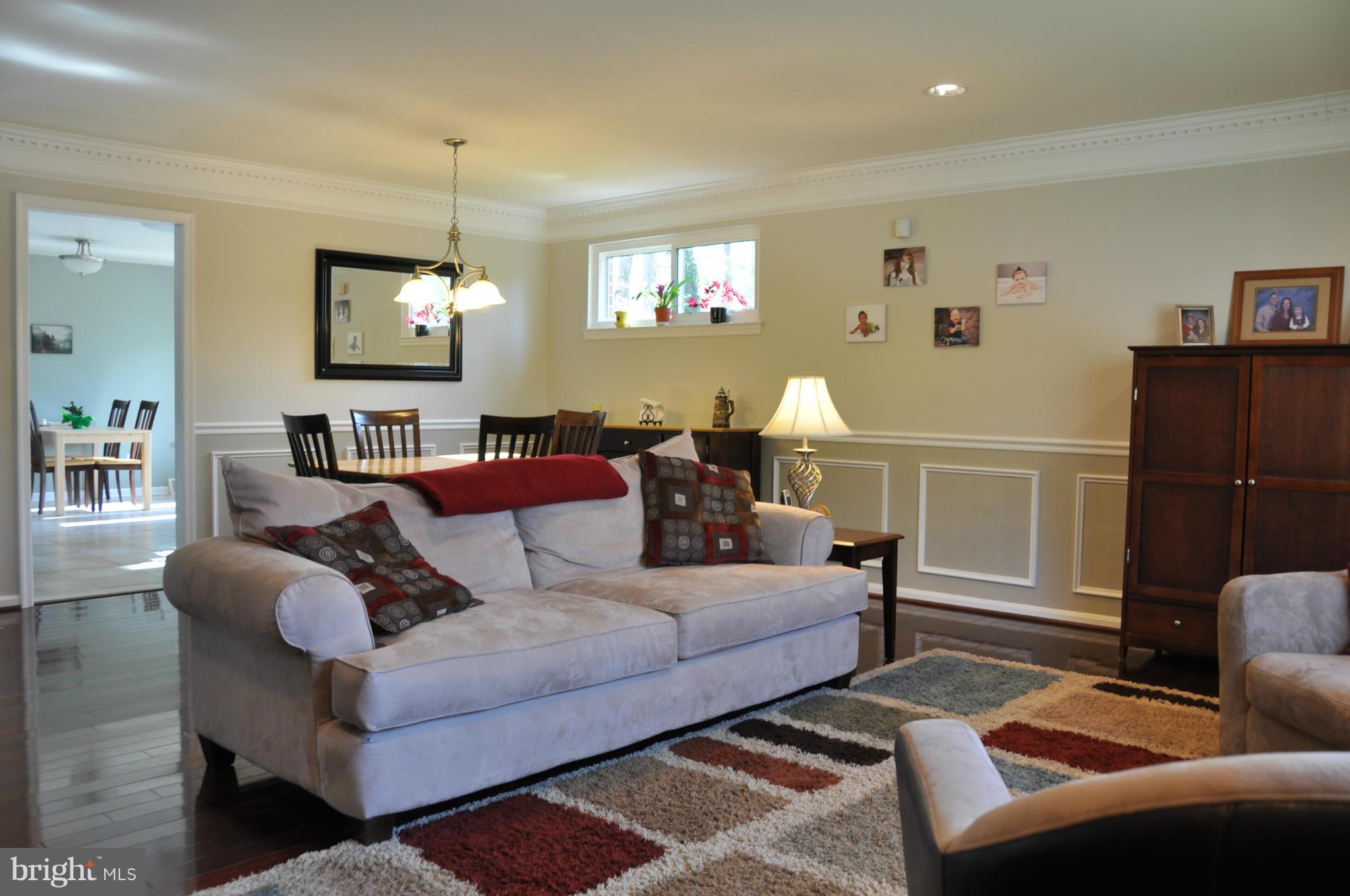 8621 Victoria Road Springfield, VA 22151 - Photo 5 of 27 a living room with furniture and a window