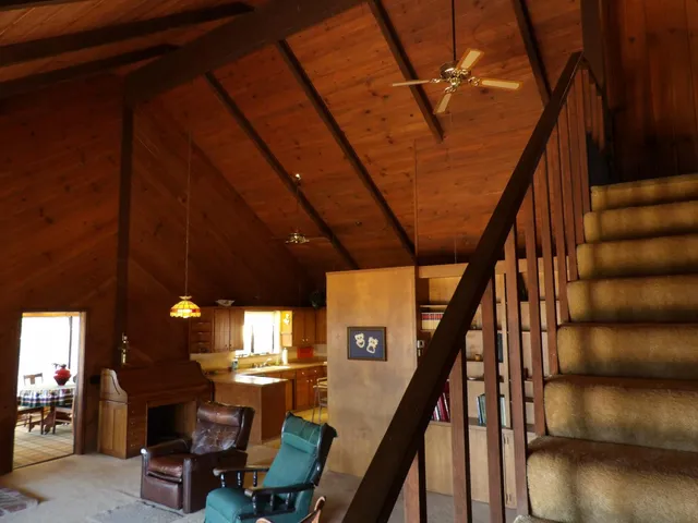 a bedroom with furniture and a window