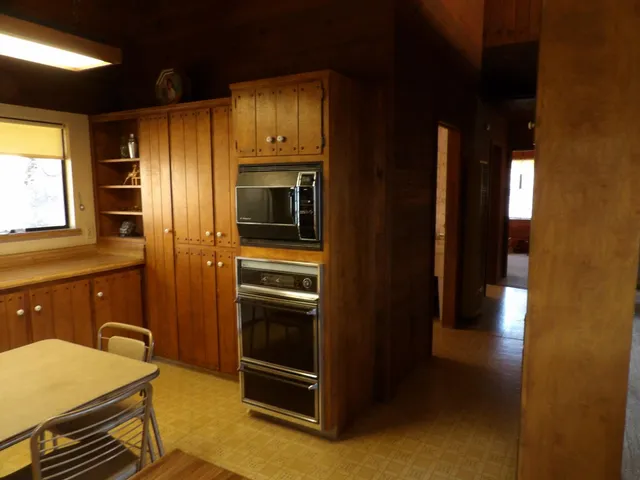a kitchen with a stove and a refrigerator