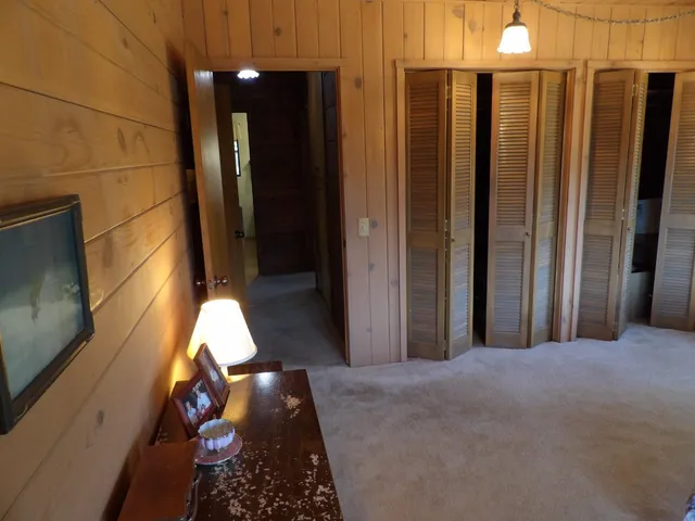 a backyard of a house with large trees