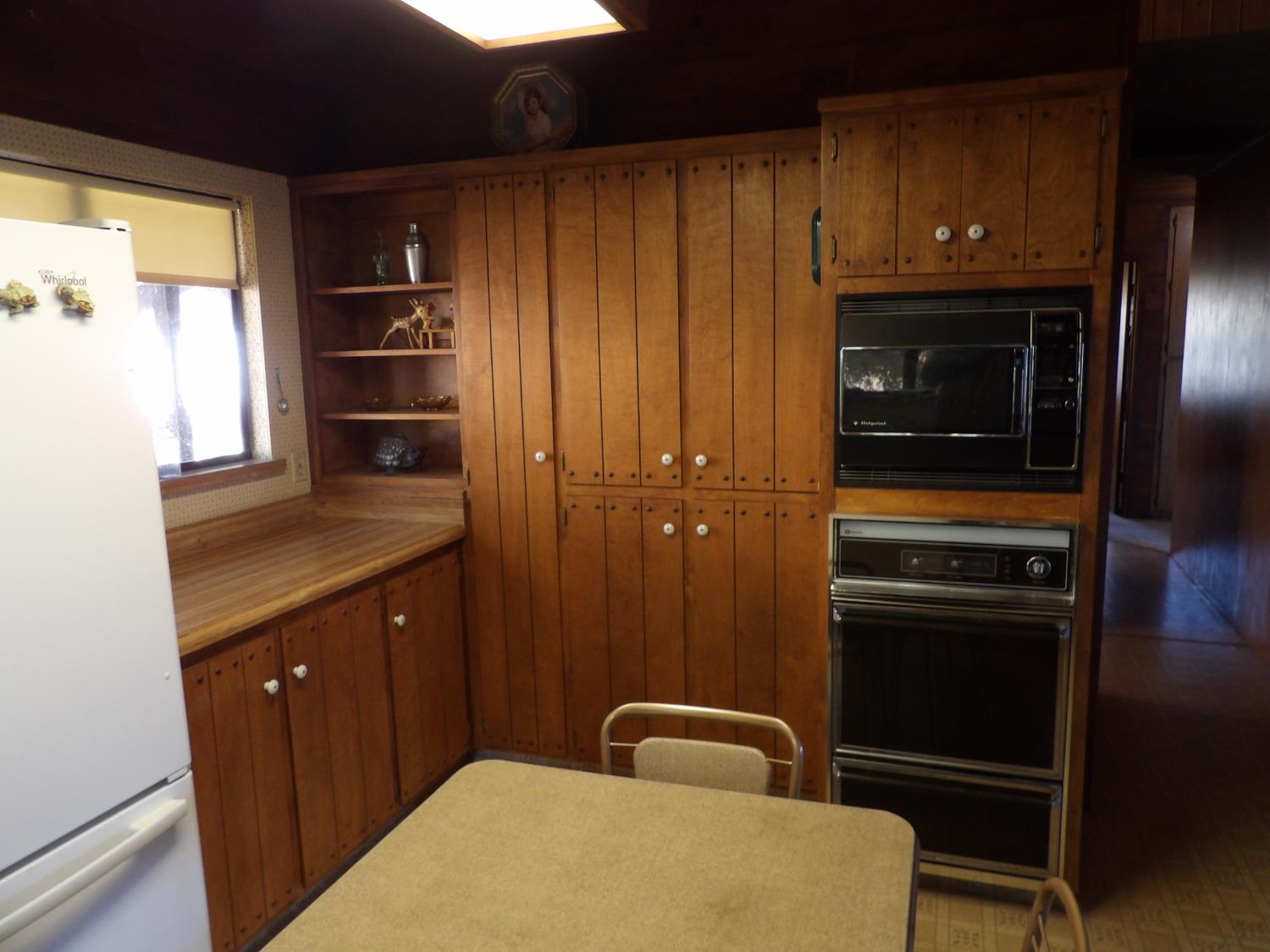 52925 Hogback Miramonte, CA 93603 - Photo 43 of 89 a kitchen with wooden cabinets and a refrigerator