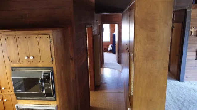 a view of a dry yard with mountains in the background