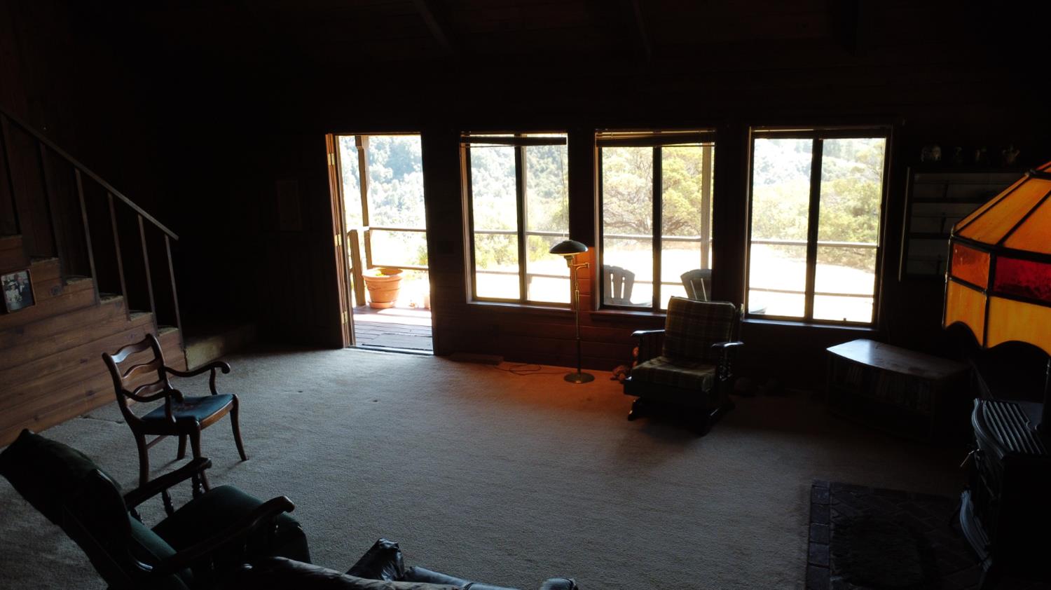 52925 Hogback Miramonte, CA 93603 - Photo 50 of 89 a living room with furniture and a floor to ceiling window