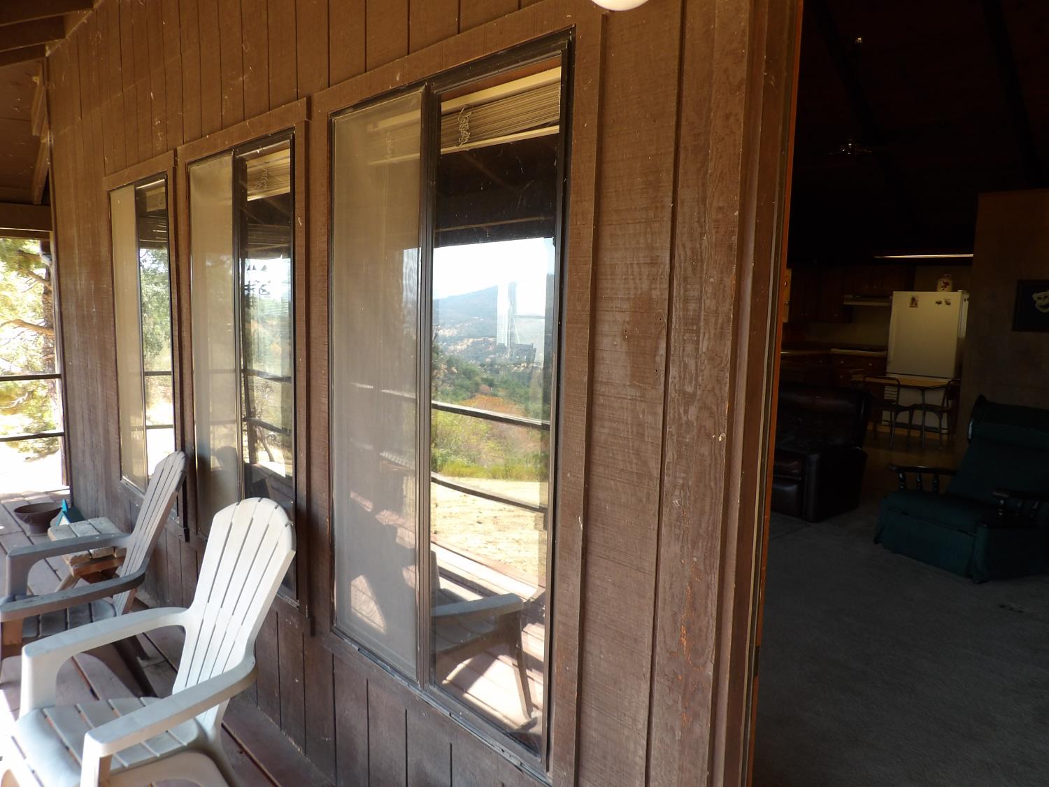 52925 Hogback Miramonte, CA 93603 - Photo 59 of 89 a living room with furniture and a floor to ceiling window