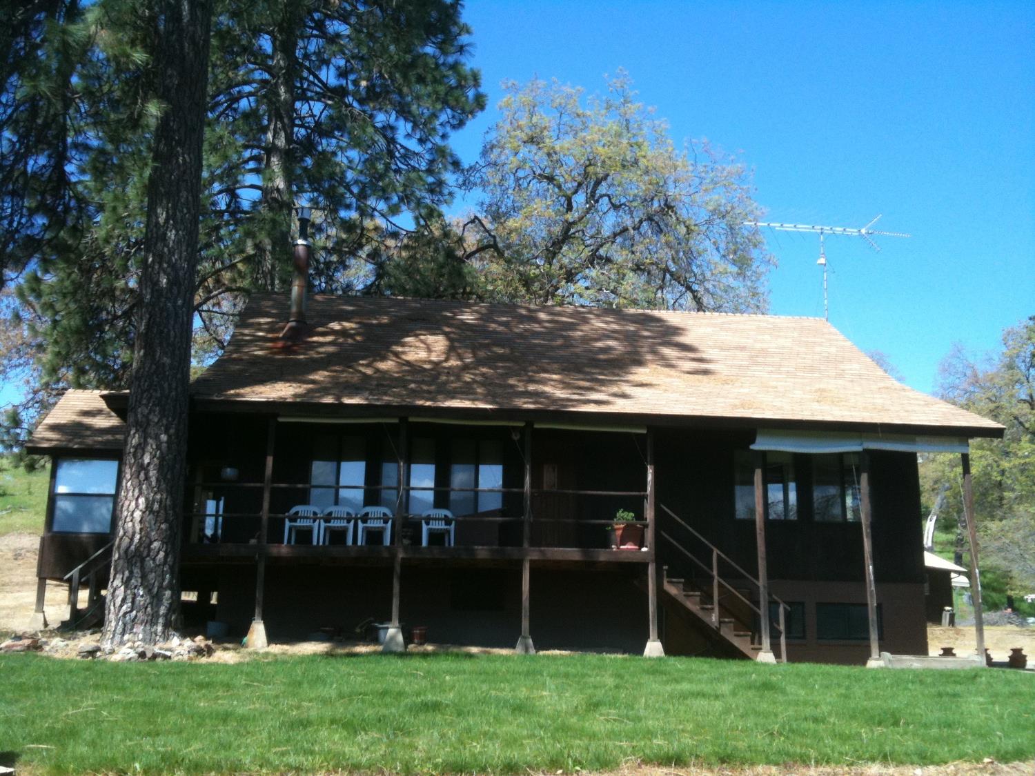 52925 Hogback Miramonte, CA 93603 - Photo 7 of 89 a view of a house with a yard balcony and a tree
