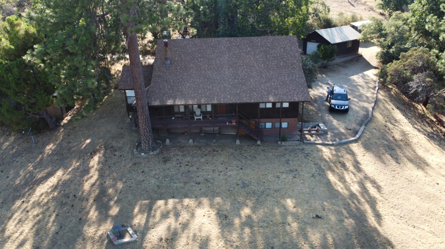 52925 Hogback Miramonte, CA 93603 - Photo 82 of 89 a view of a house with a yard and sitting area