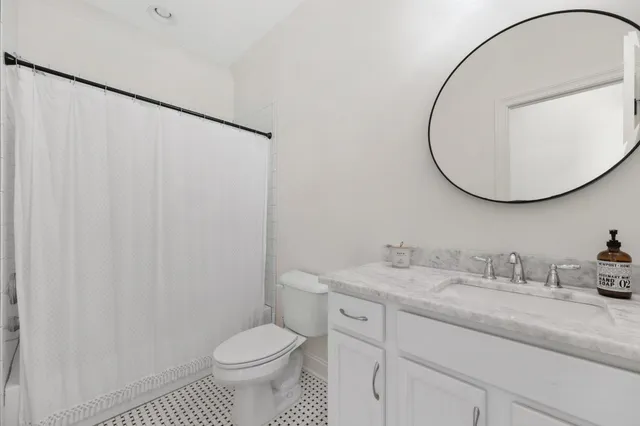 a view of a workspace with furniture and wooden floor