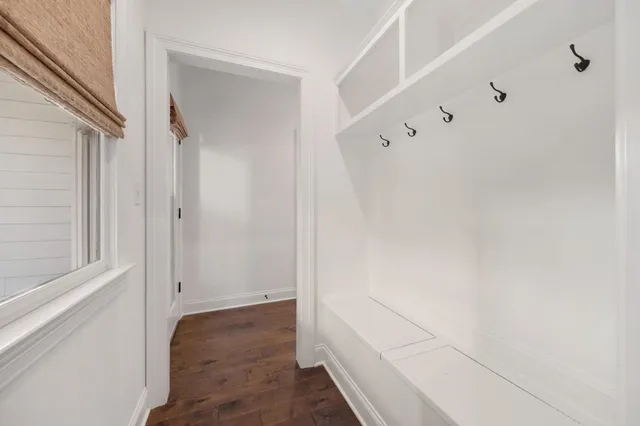 a bathroom with a shower sink and mirror