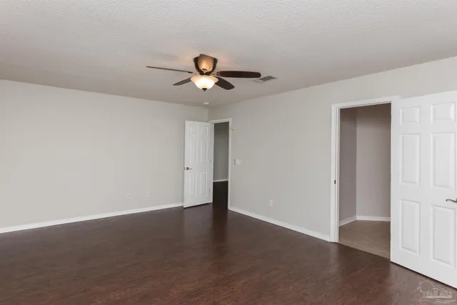a view of a room with a sink and wooden floor