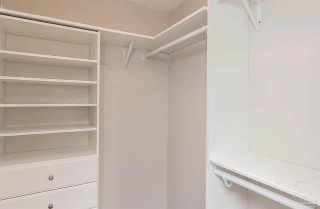 a view of an empty walk in closet