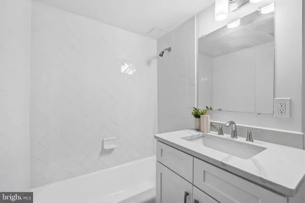 a bathroom with a sink and a bathtub