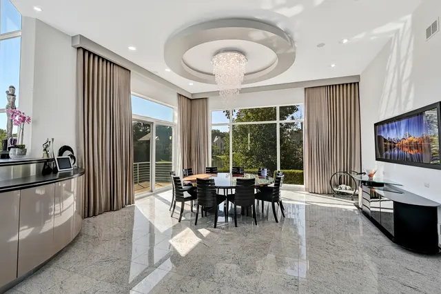 a view of a dining room with furniture window and outside view
