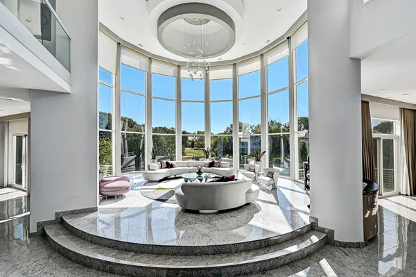 a view of a living room and a floor to ceiling window
