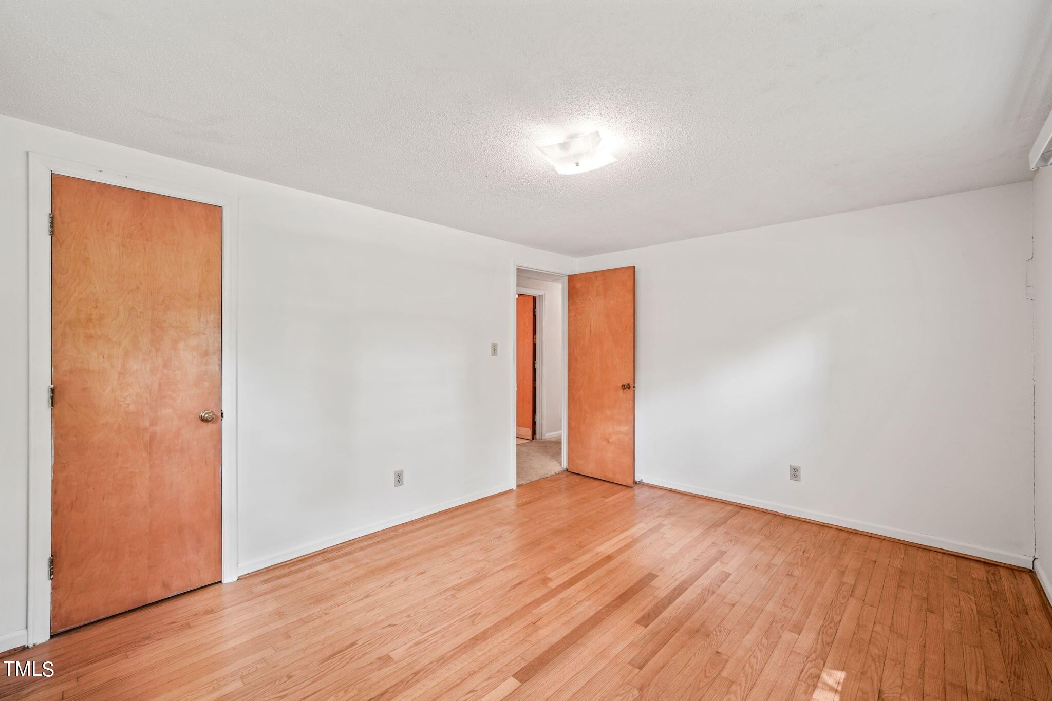 3015 Old Raleigh Road Apex, NC 27502 - Photo 22 of 47 a view of an empty room with wooden floor