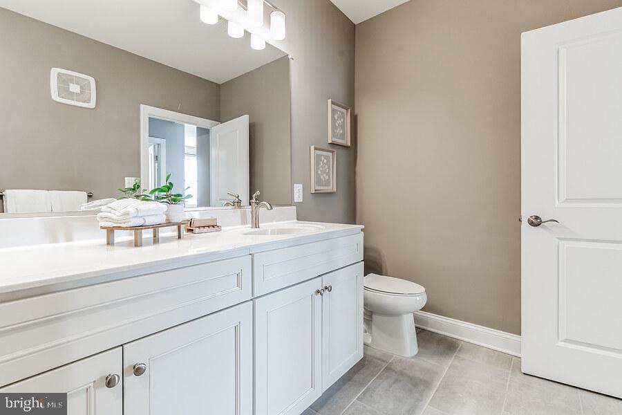406 Bold Ruler Court, Unit 204 Havre de Grace, MD 21078 - Photo 20 of 34 a bathroom with a sink toilet and a mirror